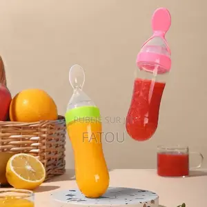 Cuillère Biberon Silicone. Distributeur Purée Bébé Rose Ou Bleu