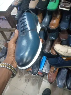 Photo - Chaussures en Cuir 100%