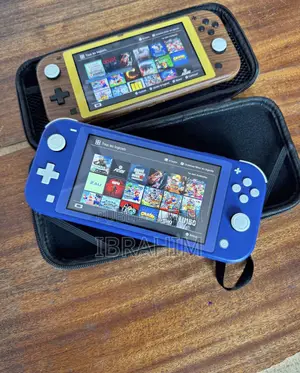 Photo - Nintendo Swith Lite Quasi Neuf Pusé 10 Jeux